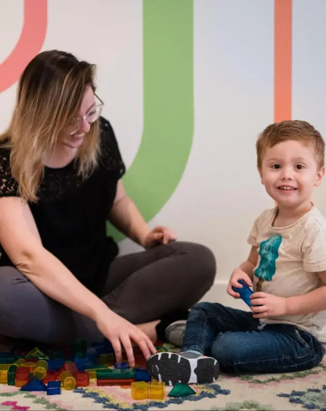 Speech therapist working with a child and parent