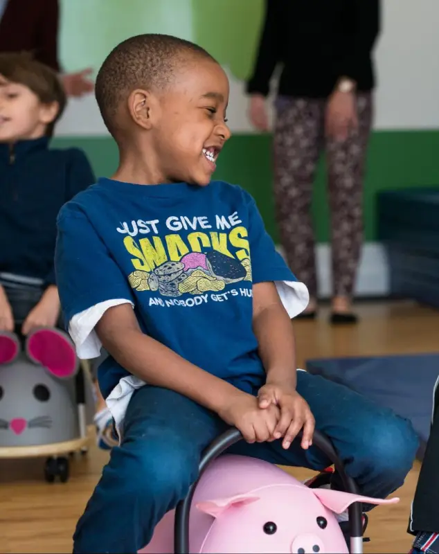 CST Academy teacher working with a young child