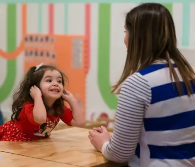 Therapist reviewing progress with child